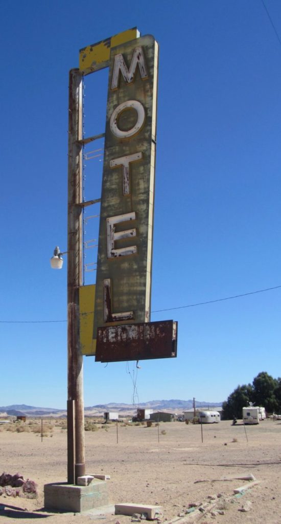 Sign at an abandoned motel