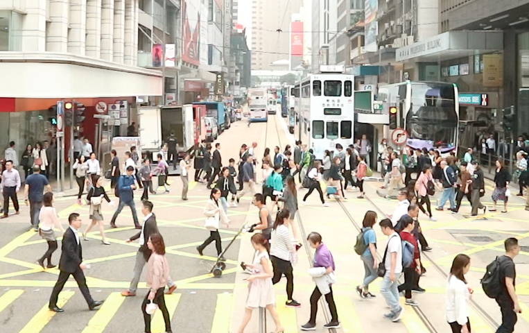 Pedestrians cross road