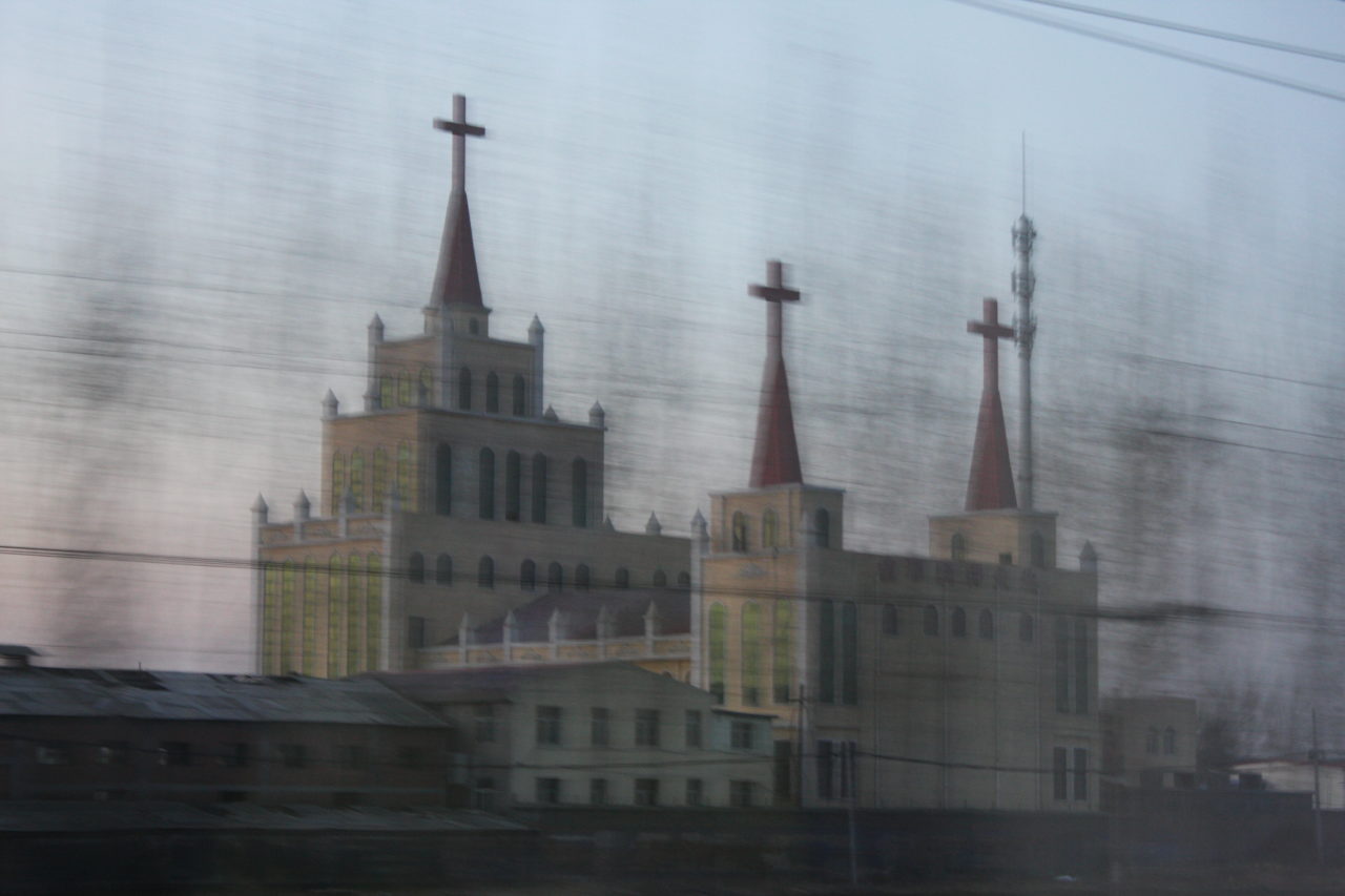 Taking the Slow Train from China:Church flashes past