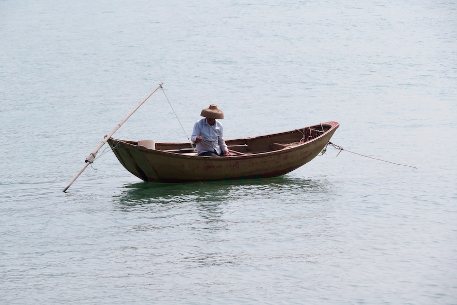 Fisherman in his sampan